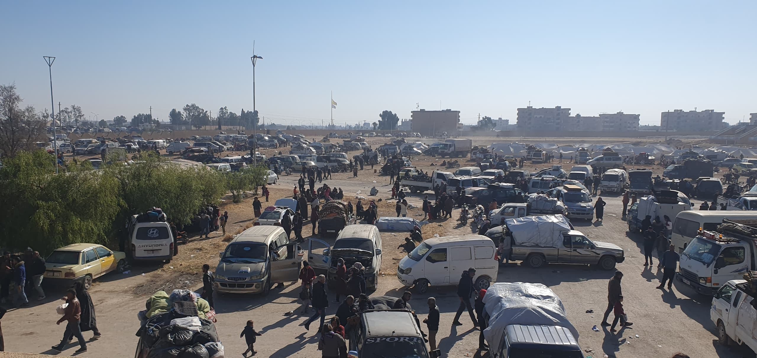 Shahba IDPs after arriving in Tabqa town in Raqqa province on December 3, 2024. Photo: Rudaw 