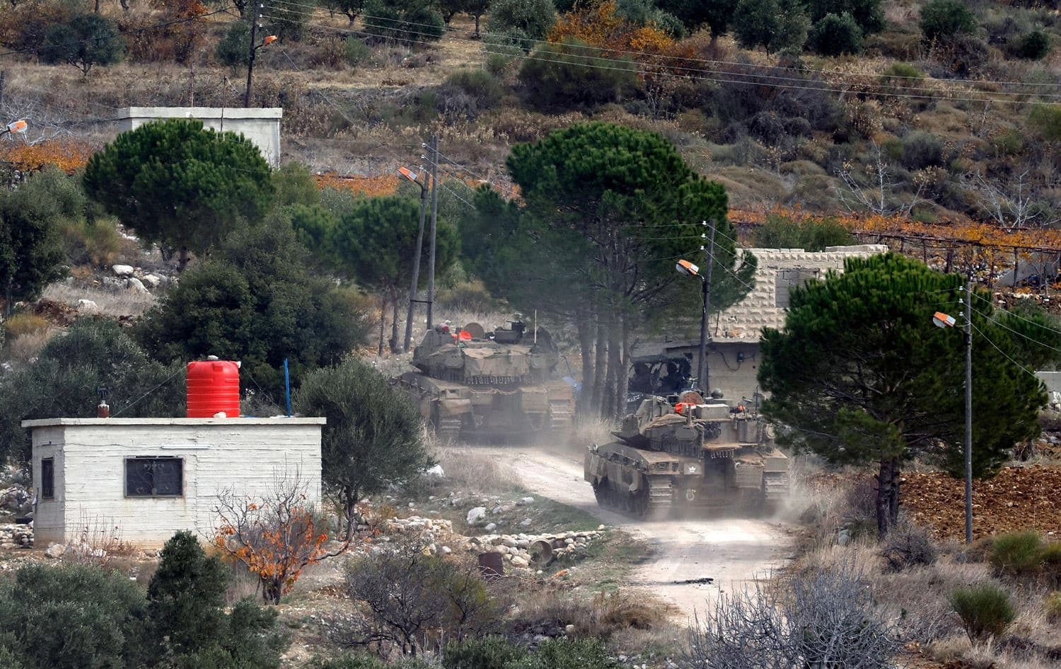 This picture shows Israeli military forces driving in the buffer zone with Syria, near the Druze village of Majdal Shams in the Israel-annexed Golan Heights, on December 11, 2024. Photo: Jalaa Marey/AFP