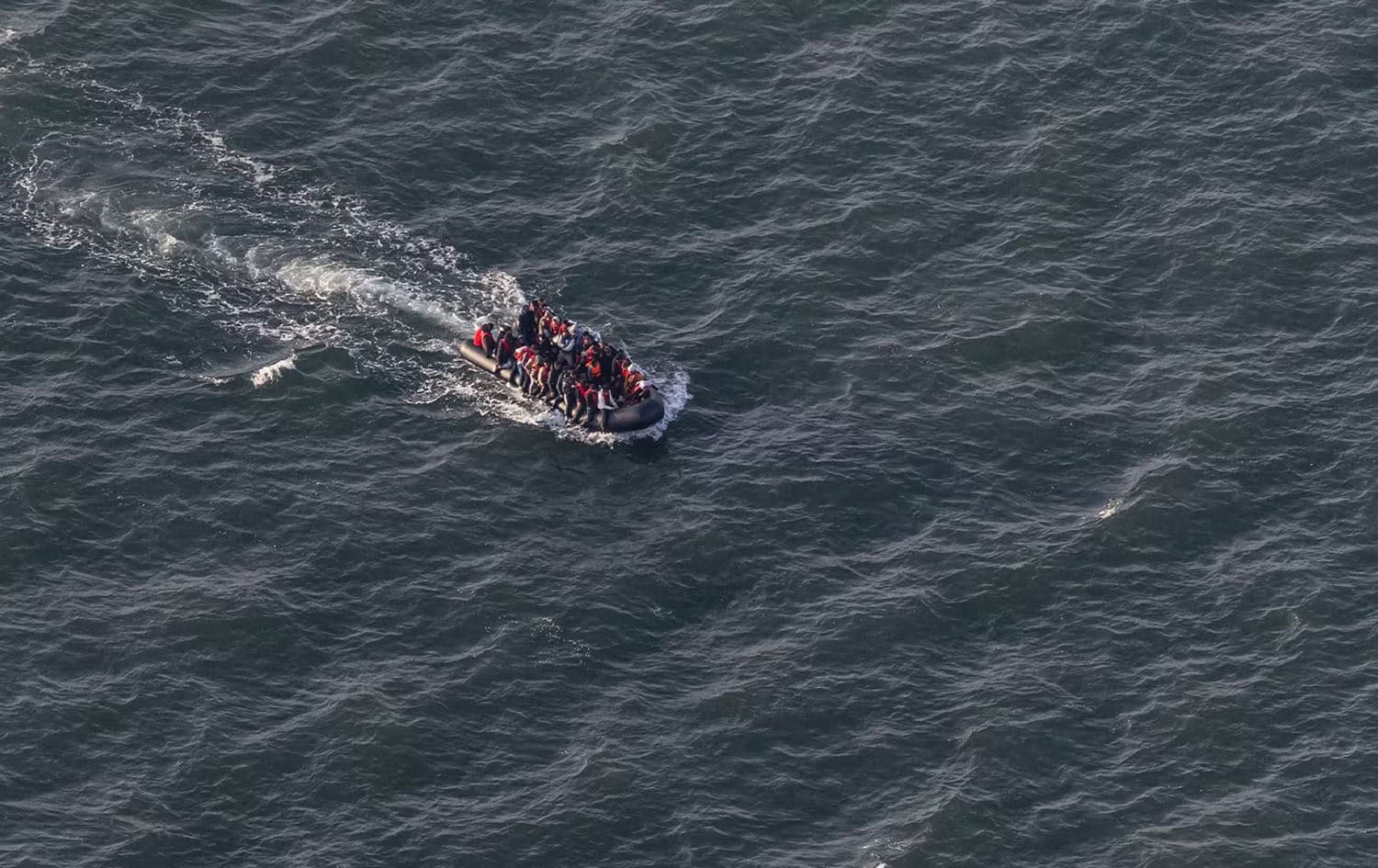 An aerial photo from September 16, 2023, shows migrants on a smuggling dinghy crossing the English Channel from Le Touquet, France. Photo: Sameer Al-Doumy/AFP
