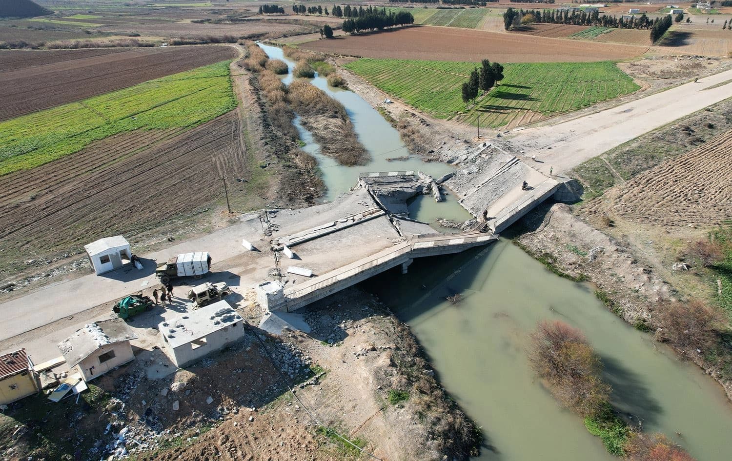 An aerial view shows a bridge, destroyed in an Israeli airstrike, in the town of in Qusayr in Syria's central Homs province on December 14, 2024. Photo: Aaref Watad/AFP