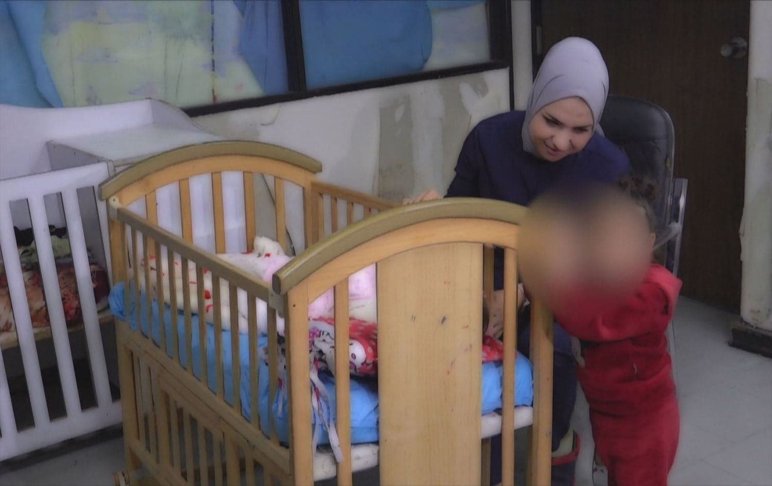 A nurse in Kirkuk hospital taking care of an abandoned child in December 2024. Photo: Rudaw