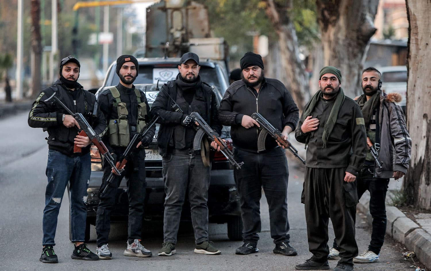Members of a local rebel militia pose for a picture during a patrol in Syria's southern city of Sweida on December 29, 2024. Photo: Bakr Alkasem/AFP