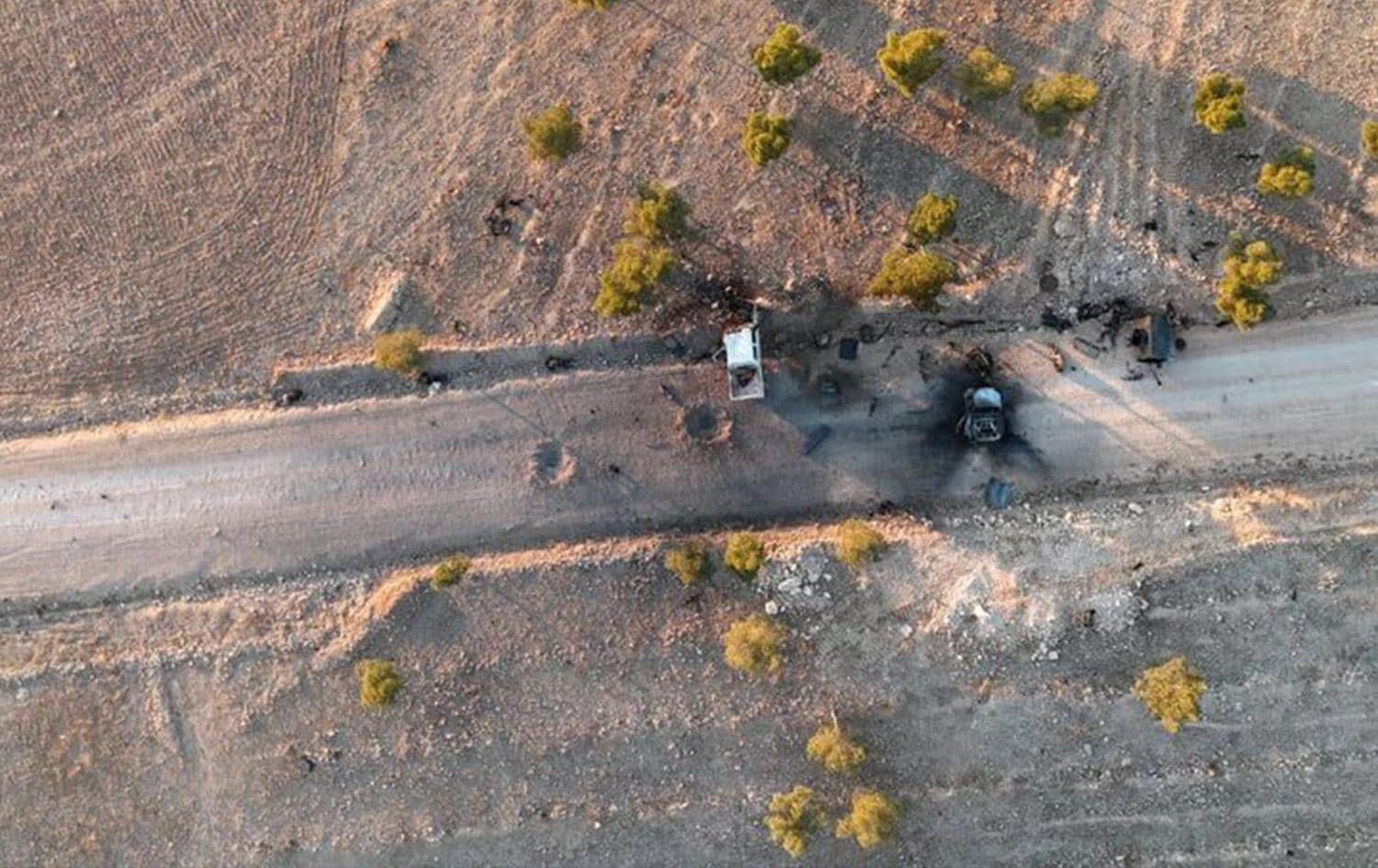 An aerial image published by the Kurdish-led Syrian Democratic Forces (SDF) shows destroyed SNA vehicles on a roadside near Tishreen Dam in northern Syria on January 4, 2025. Photo: Farhad Shami/X