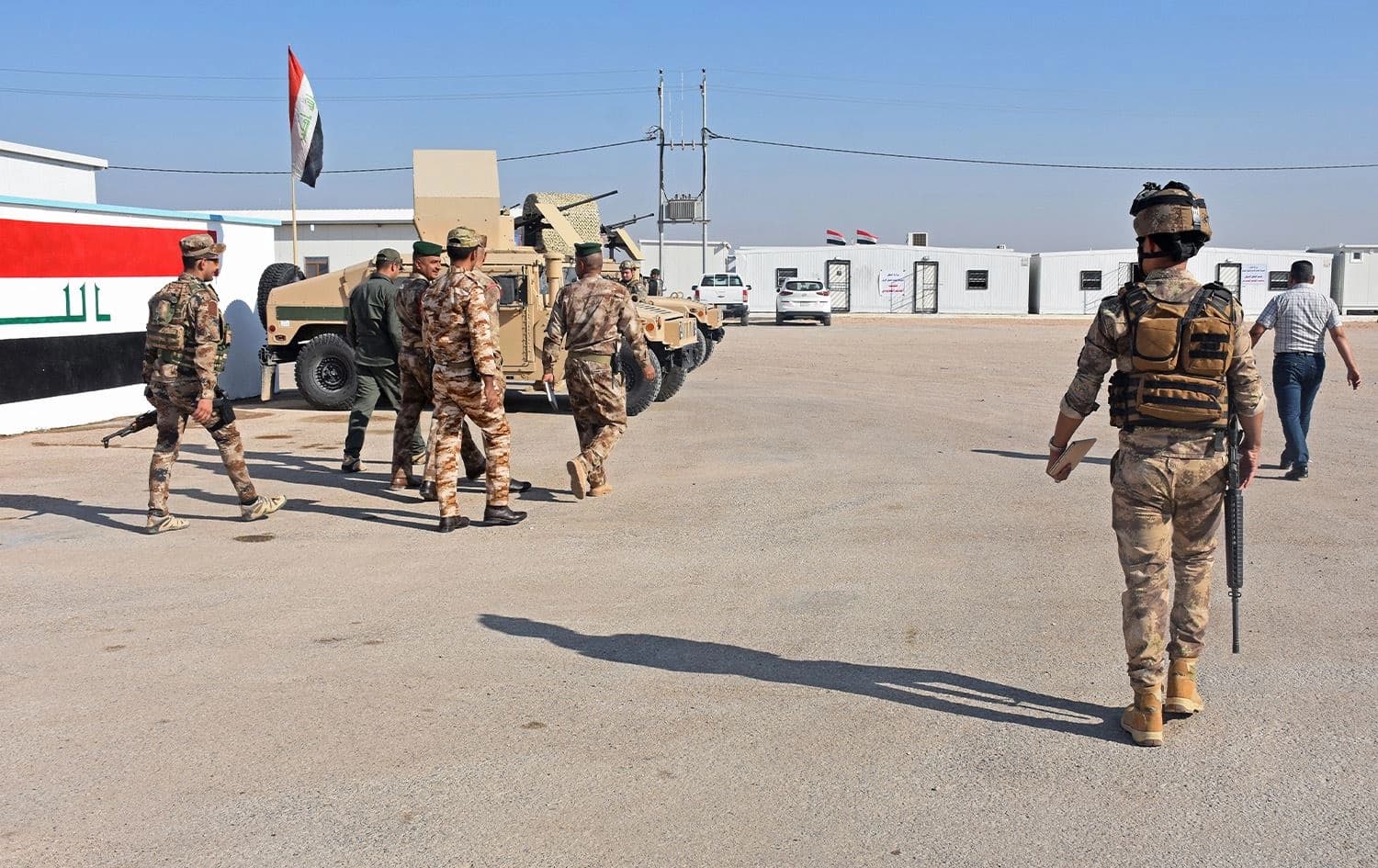Iraqi security forces walk on the Iraqi side of the border-crossing between al-Qaim in Iraq and al-Bukamal in Syria, on September 30, 2019. Photo: AFP