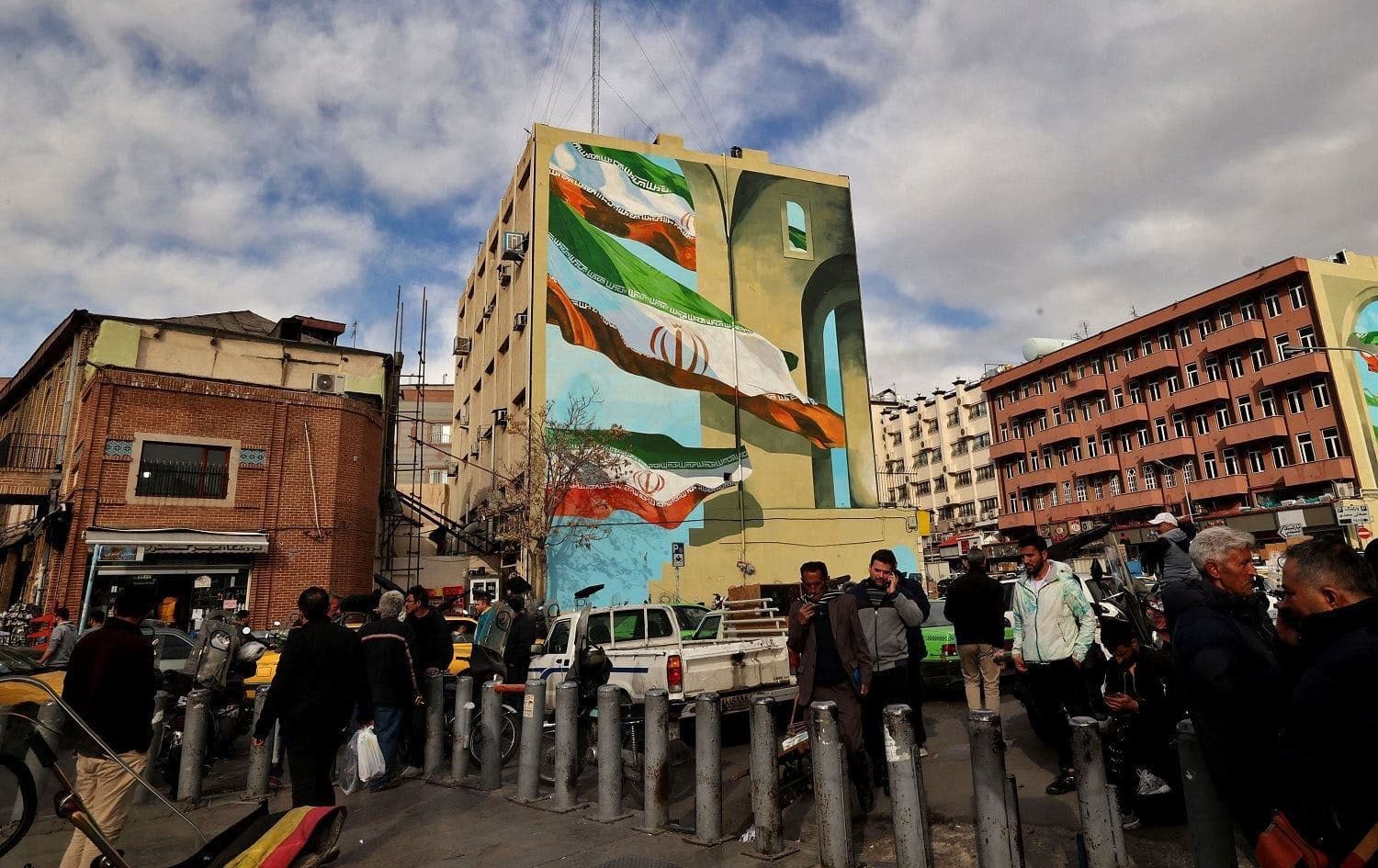 People walk in a commercial area in Tehran on February 21, 2023. File photo: AFP