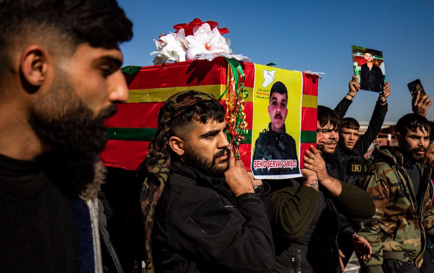 Mourners carry the coffin of one of two Kurdish Syrian Democratic forces (SDF) fighters, killed days earlier in battle with Turkish-backed Syrian forces in the northern city of Manbij, during their funeral in Qamishli on January 2, 2025. Photo: Delil Souleiman/AFP