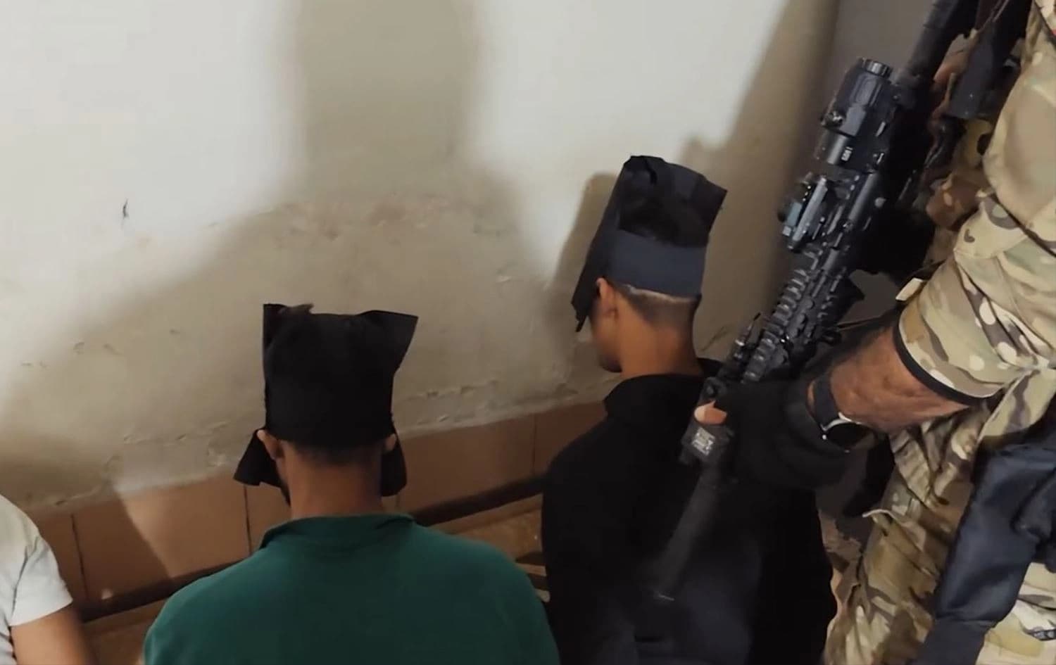 CTG security members arresting suspected ISIS members in a house in Sulaimani province. Photo: screengrab/CTG Kurdistan on Facebook