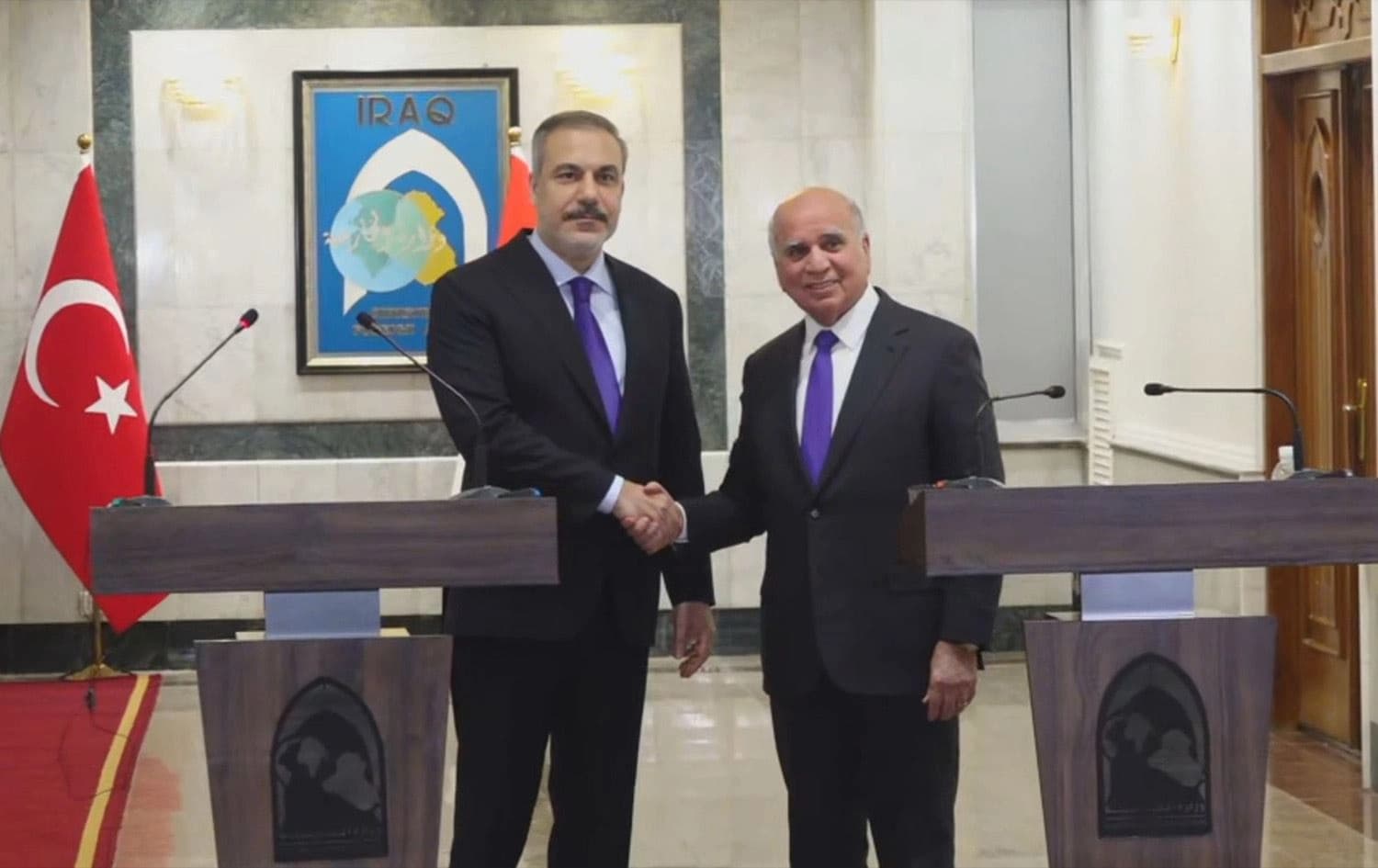 Iraqi Foreign Minister Fuad Hussein (right) shaking hands with his Turkish counterpart Hakan Fidan (left) after concluding a joint press conference in Baghdad on January 26, 2025. Photo: Rudaw