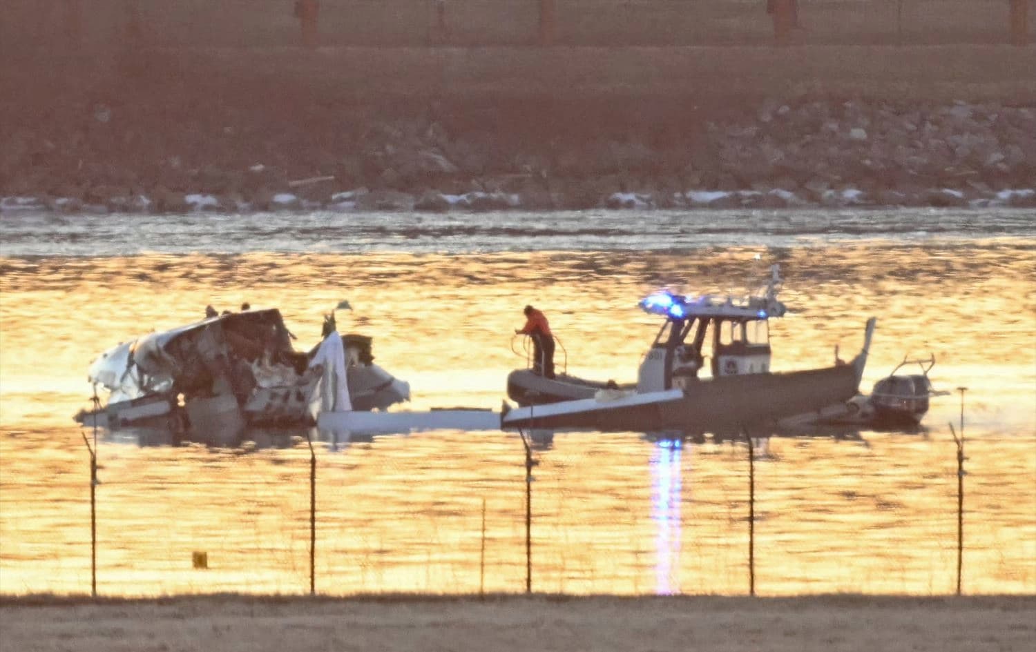Wreckage is seen as rescue boats search the Potomac River after a plane approaching Reagan National Airport crashed near Washington DC, on January 30, 2025. Photo: Andrew Caballerro-Reynolds/AFP