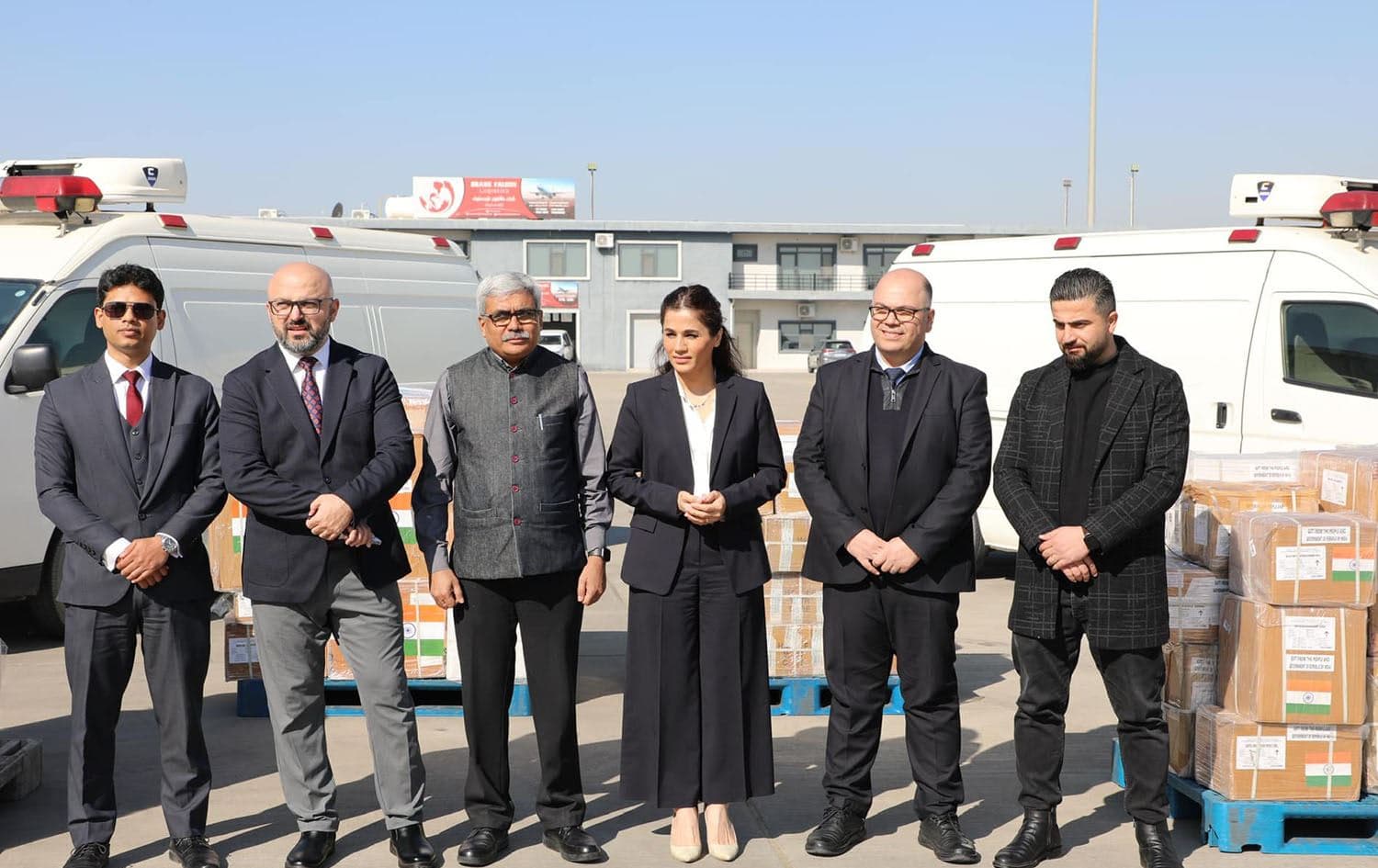 Halabja Mayor Nuxsha Nasih (center right) and Indian Consul General to Erbil Madan Gopal (center left) at Sulaimani International Airport after India delivered over 1.5 tons of aid to the province on February 3, 2025. Photo: Nuxsha Nasih/Facebook