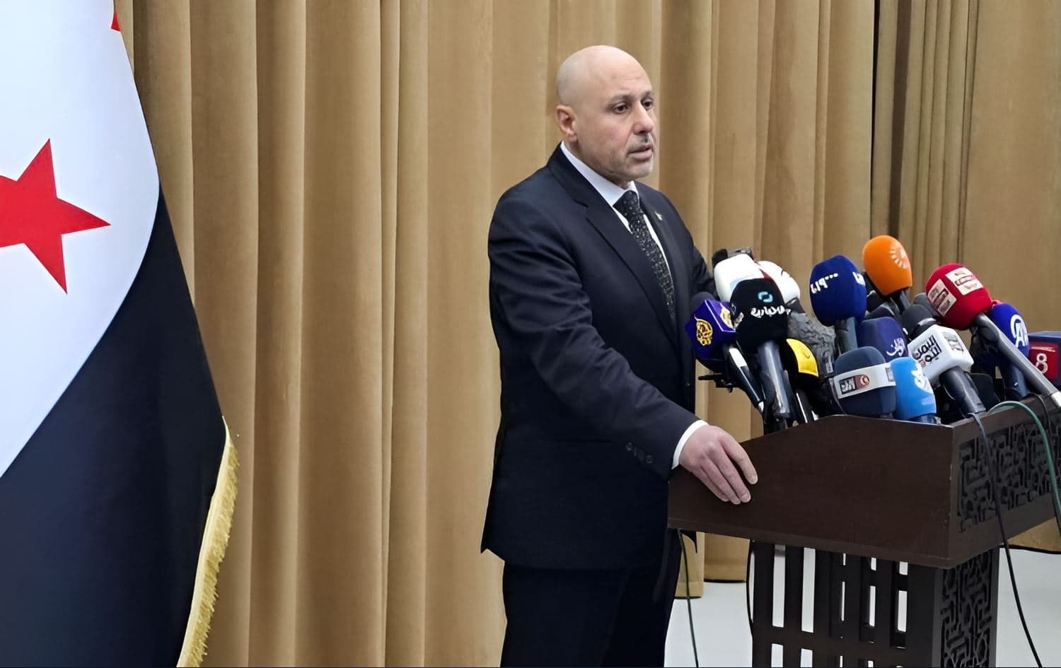 Yassir al-Farhan, spokesperson for an investigative committee formed to probe into recent violence in coastal areas of Syria, speaking during a press conference on March 11, 2025. Photo: screengrab/Rudaw
