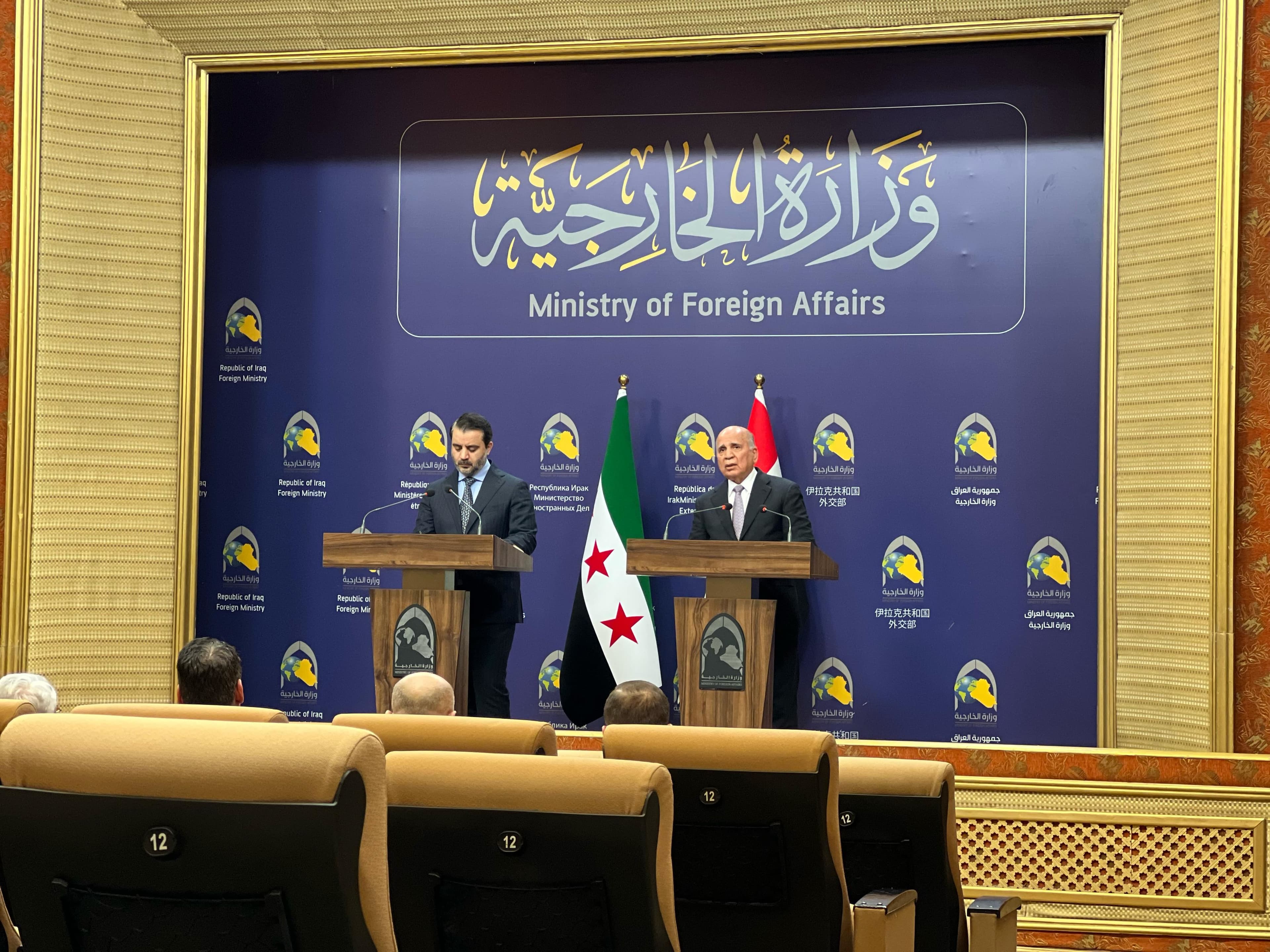 Syrian Foreign Minister Asaad al-Shaibani (left) and his Iraqi counterpart Fuad Hussein (right) during a joint press conference in Baghdad on March 14, 2025. Photo: Rudaw