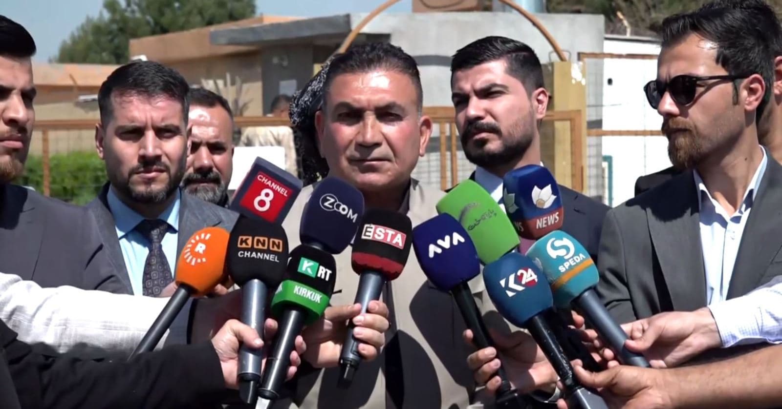 Mohammed Amin (center) speaks to reporters in Dibis northwest Kirkuk on March 17, 2025. Photo: Screengrab/Rudaw