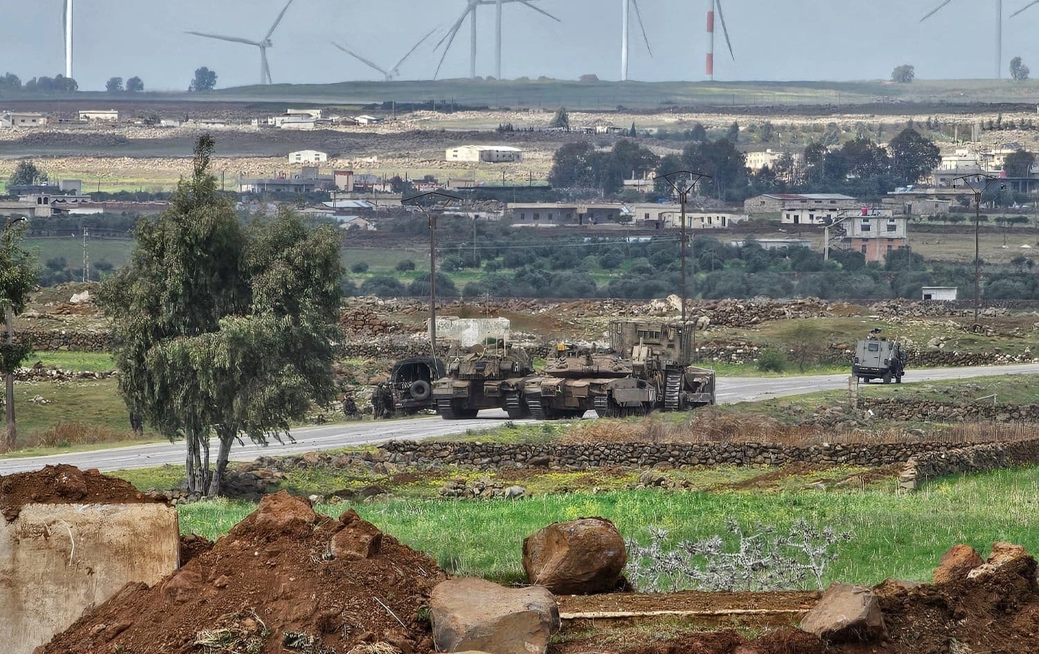 Israeli army tanks and a bulldozer drive through the Abu Diab military post on March 19, 2025, on the southern outskirts of the Syrian border town of Quneitra. Photo: Bakr Alkasem/AFP