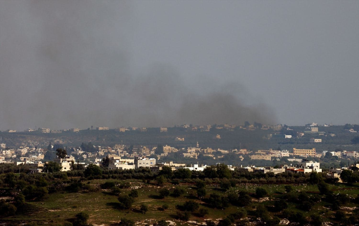 Smoke billowing from Israel-annexed Golan Heights along the border with southern Syria during an Israeli bombardment on March 25, 2025. Photo: Jalaa Marey/AFP