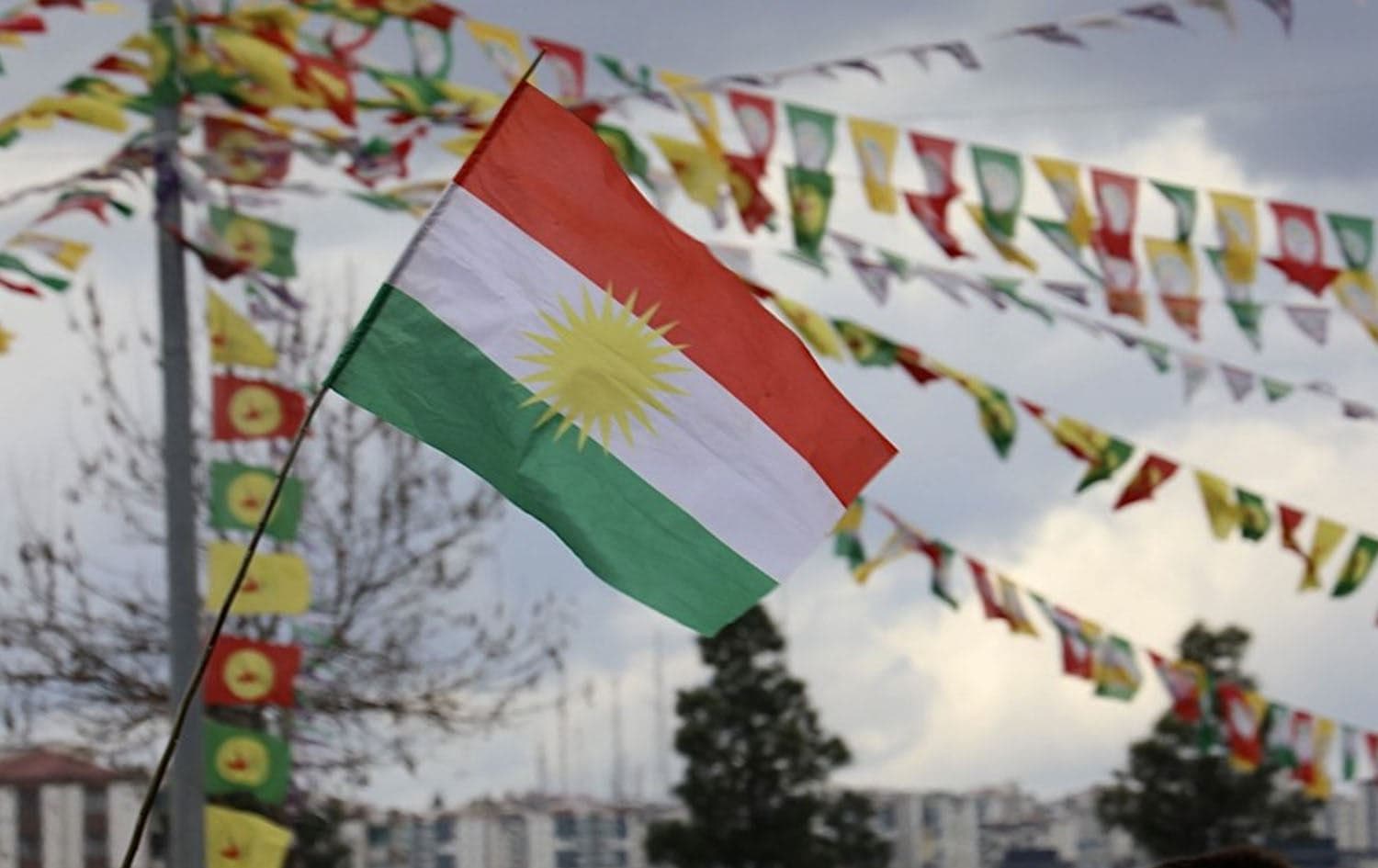 A Kurdistan flag is raised during a Newroz celebration in Diyarbakir, Turkey on March 21, 2025. Photo: Murat Bulut/Rudaw