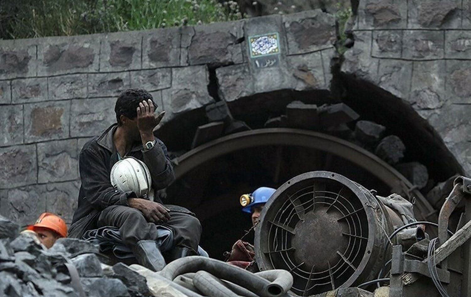 A miner grieving outsude a mine in Iran. File photo: IRNA