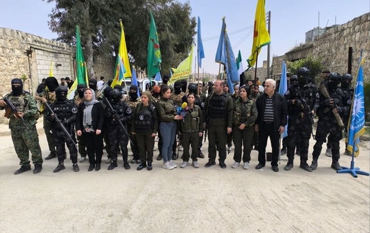 Fighters of the Kurdish-led Syrian Democratic Forces (SDF) handing over the security of northern Aleppo's Kurdish-majority neighborhoods of Sheikh Maqsood and Ashrafiyeh before withdrawing to northeast Syria (Rojava) on April 9, 2025. Photo: Ronahi TV