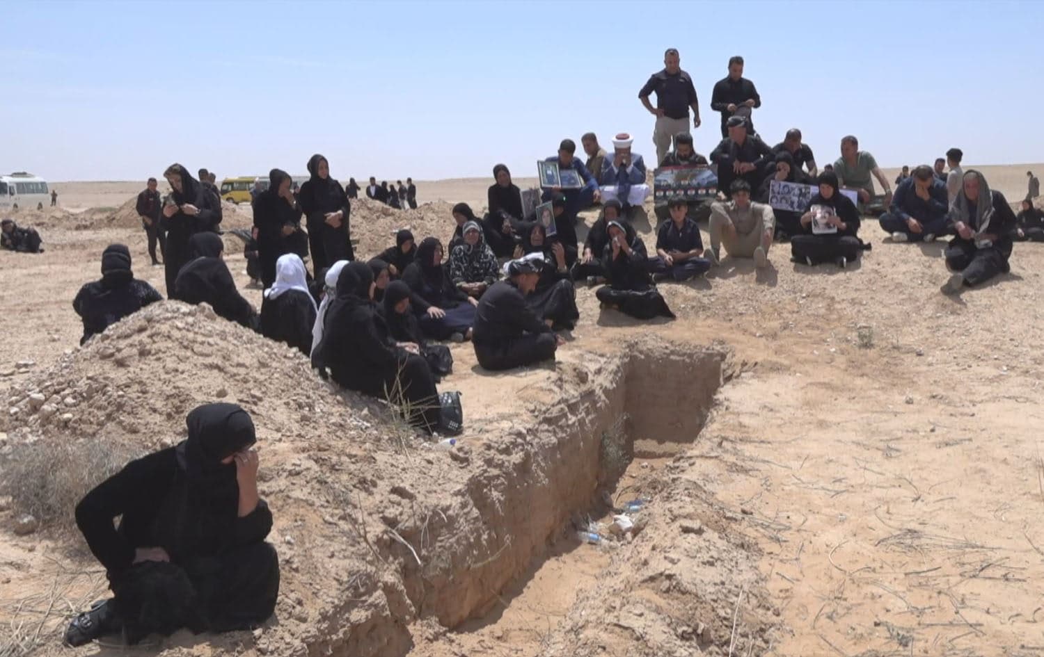 Relatives of Anfal victims visit an exhumed mass grave site in Iraq’s southern Arar Desert on April 21, 2025. Photo: Screengrab/Rudaw