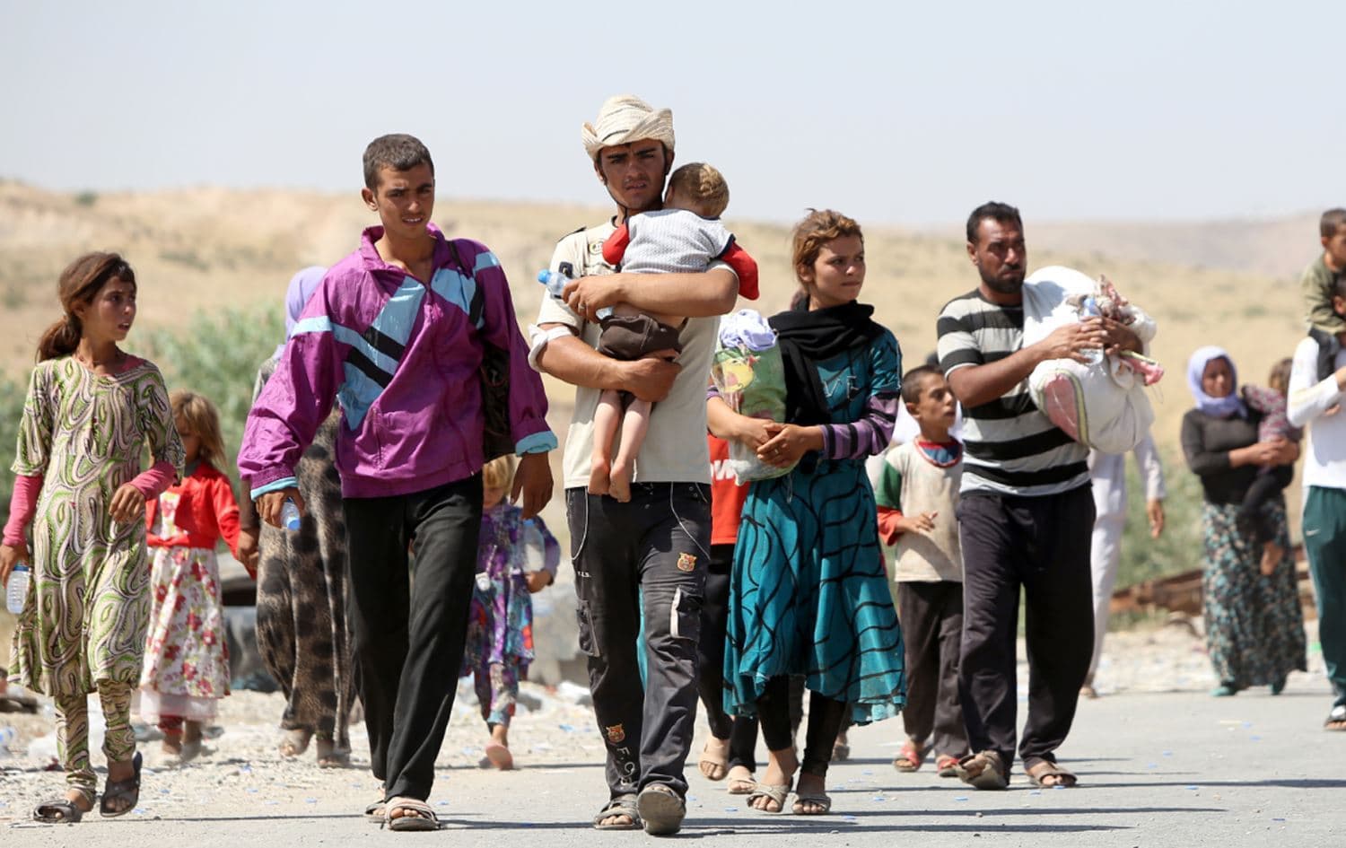Yazidis fleeing ISIS attack on August 11, 2014. Photo: Ahmad al-Rubaye/AFP