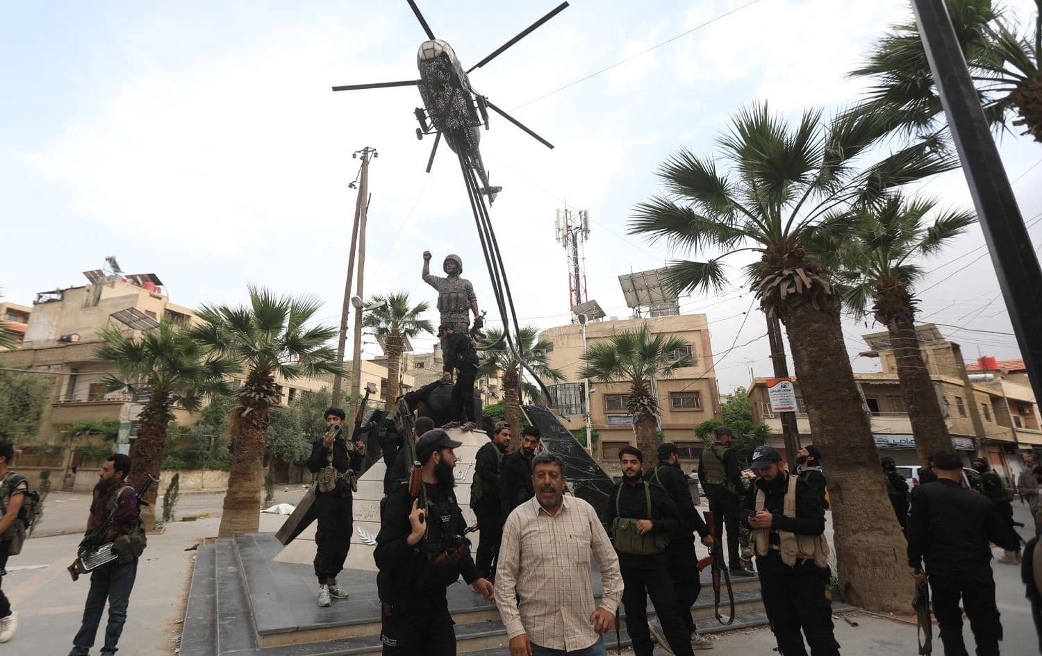 ژمارەیەک سەربازی سوپای سووریا لە نزیک دیمەشق. وێنە: AFP