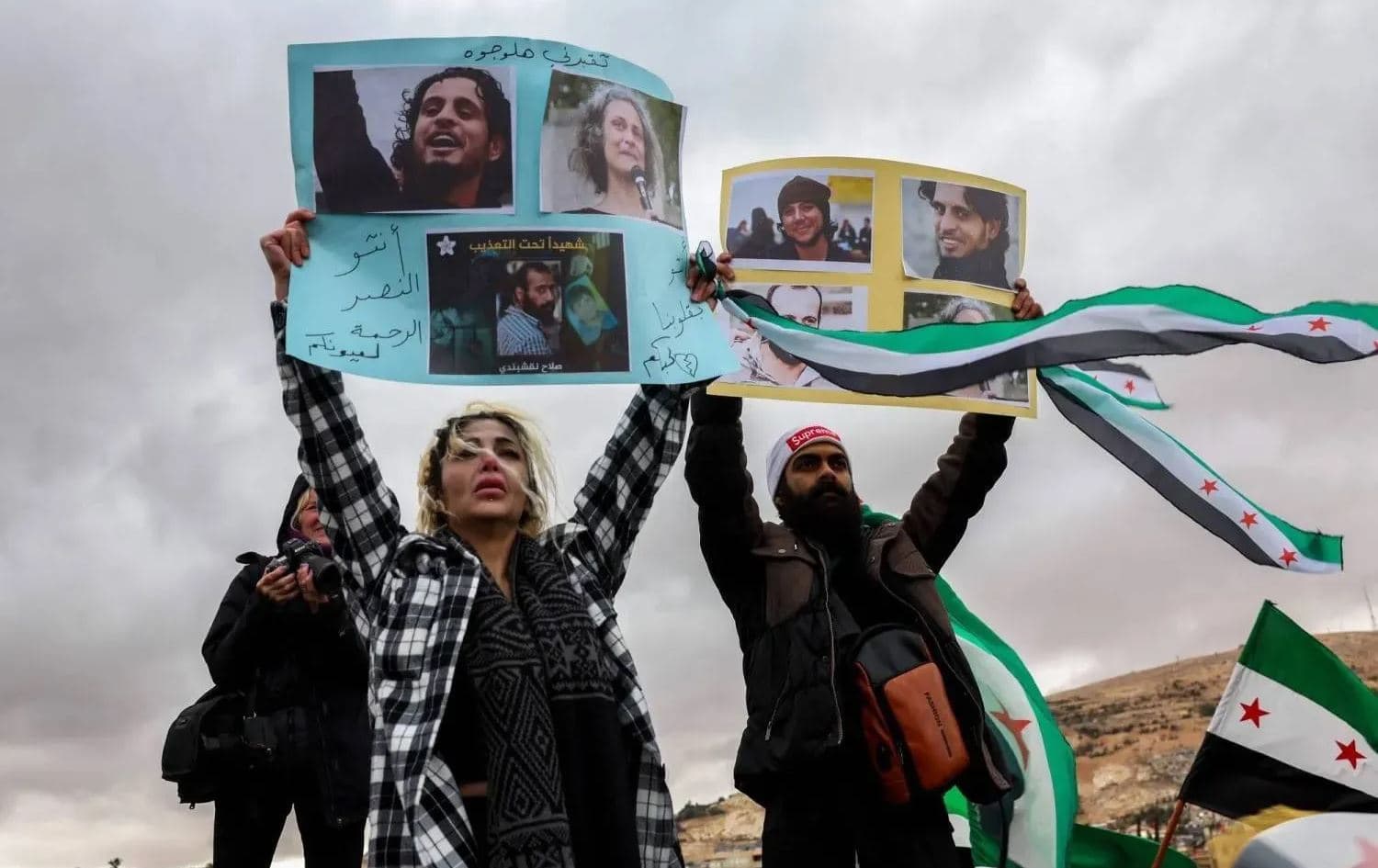 Demonstrators hold photos of missing persons at the Umayyad Square in Damascus. Photo: AFP