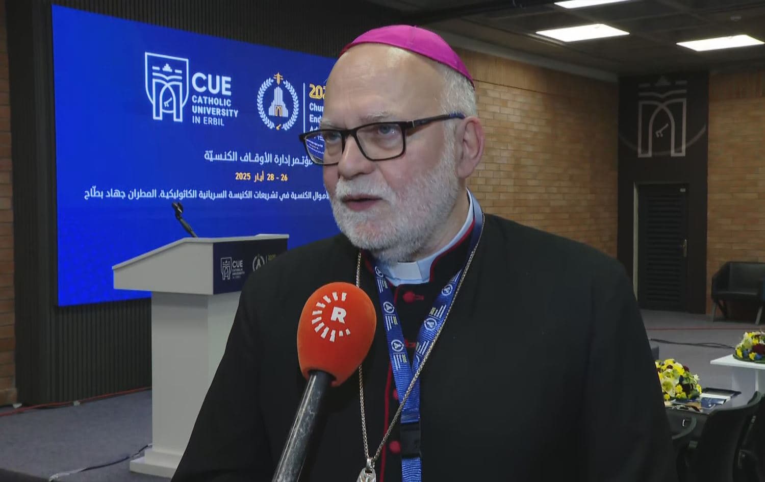 Syriac Catholic Archbishop of Damascus Youhanna Jihad Battah speaking to Rudaw on the sidelines of the Church Endowments Administration Conference, hosted by the Catholic University in Erbil, on May 27, 2025. Photo: Rudaw