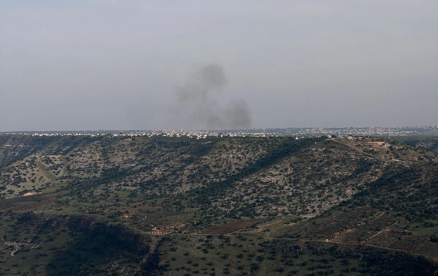 This picture taken from Israel-annexed Golan Heights along the border with southern Syria shows smoke billowing above the Syrian territory during Israeli bombardment, on March 25, 2025. Photo: Jalaa Marey/AFP