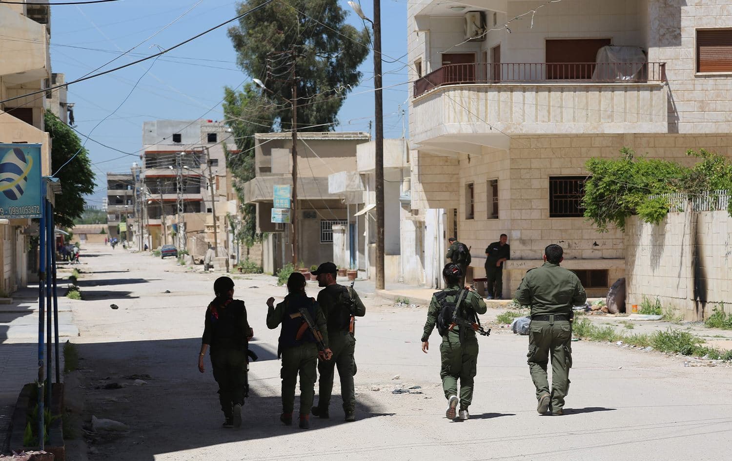 Members of the Kurdish internal security forces (Asayish) patrol the streets of Hasaka. File photo: AFP