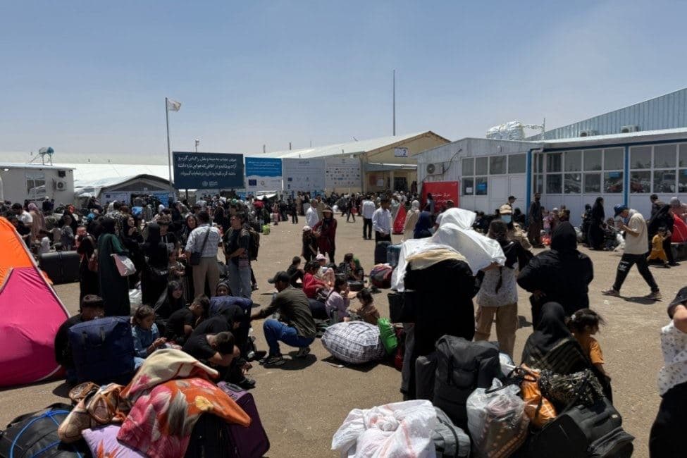 Afghans deported from Iran pictured at the Islam Qala border crossing on June 30, 2025. Photo: UNmigration/X