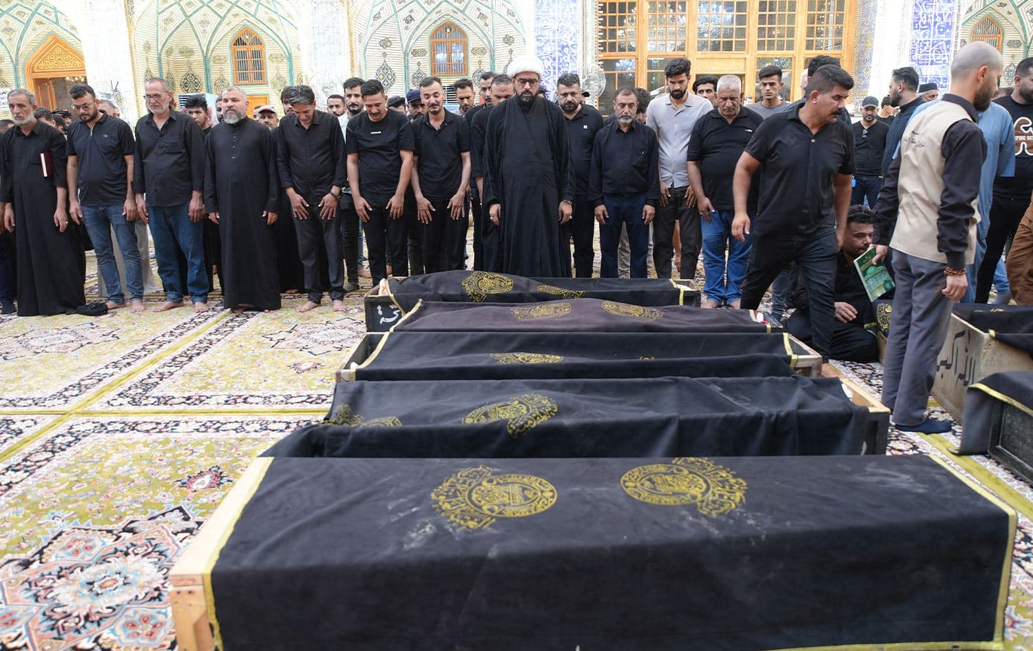Iraqis mourn the victims of a shopping mall fire in the city of Kut, during their funeral at the Imam Ali Shrine in Iraq's central holy city of Najaf on July 17, 2025. Photo: Qassem al-Kaabi/AFP