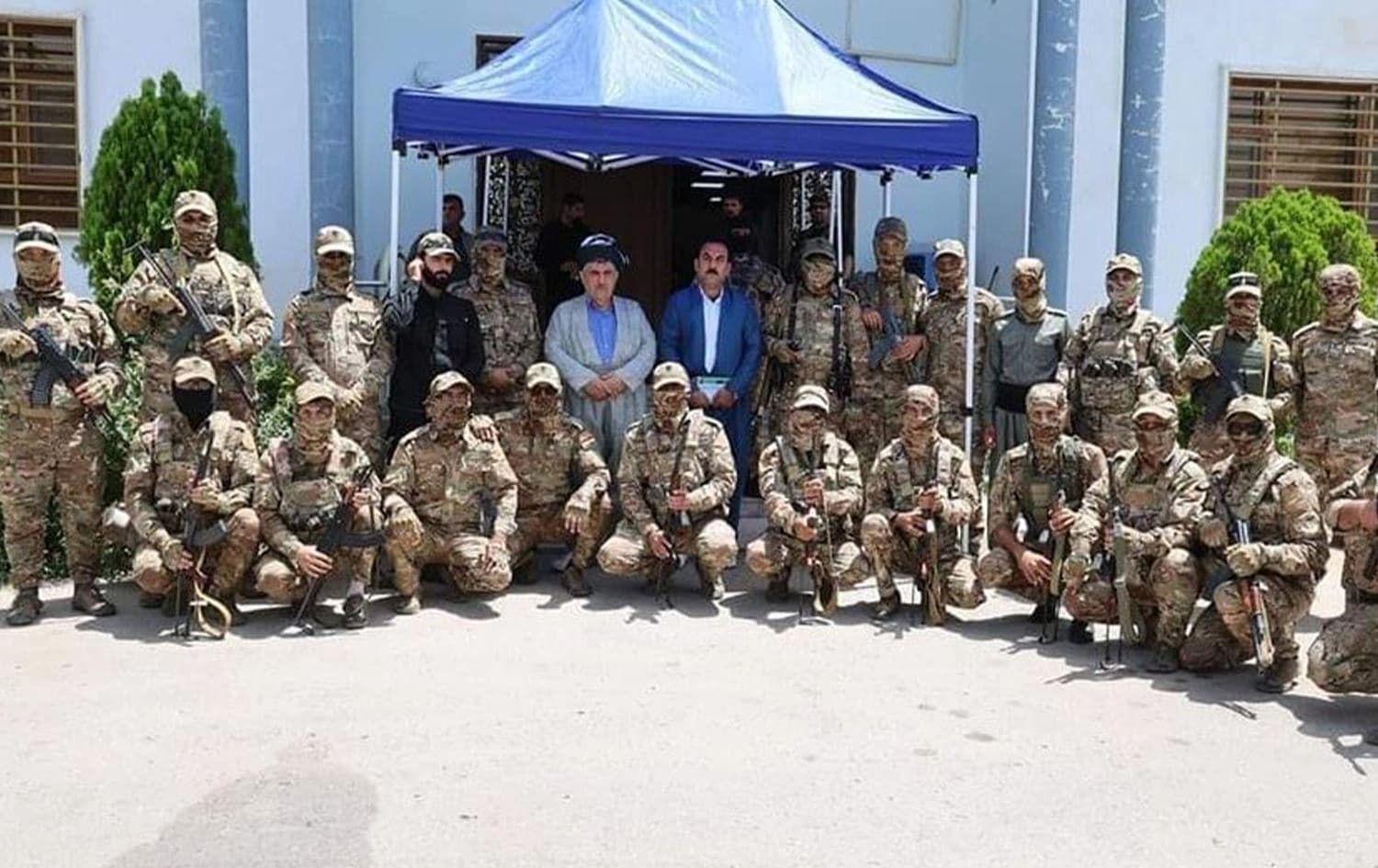 KSDP Peshmerga fighters pose with their leader Mohammed Haji Mahmoud. Photo: Submitted