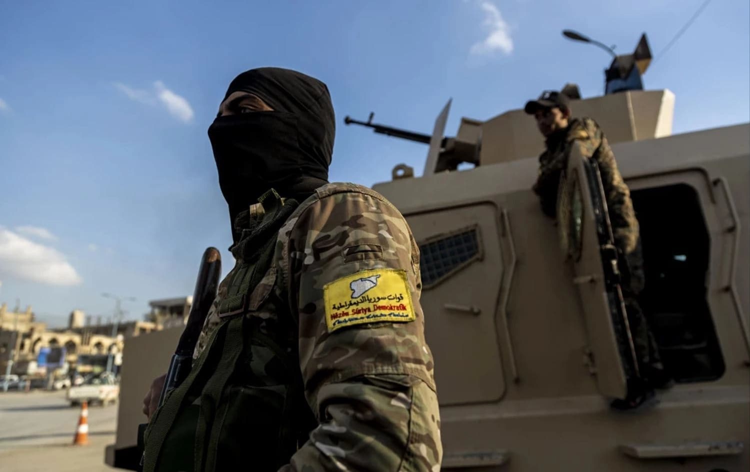Syrian Democratic Forces (SDF) fighters stand guard at Al Naeem Square, in Raqqa, Syria on February 7, 2022. File photo: AP