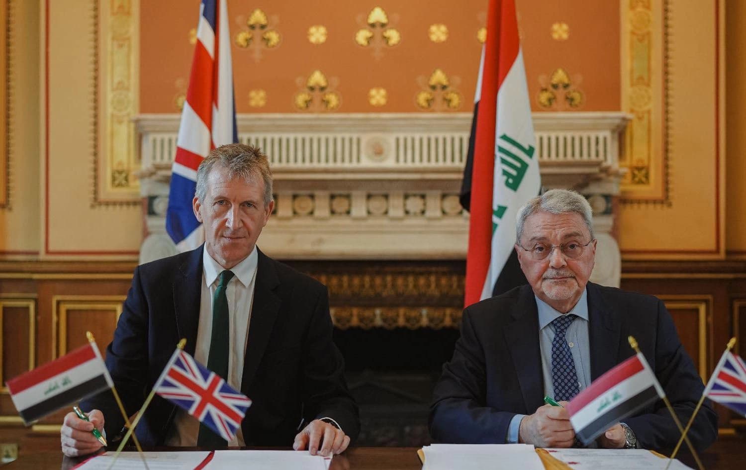 UK’s Security Minister Dan Jarvis (left) and Hazem al-Yousifi, the Iraqi foreign ministry’s undersecretary for legal affairs and multilateral relations (right) signing a deal to tackle illegal migration in London on August 20, 2025. Photo: Photo: Dan Jarvis/X