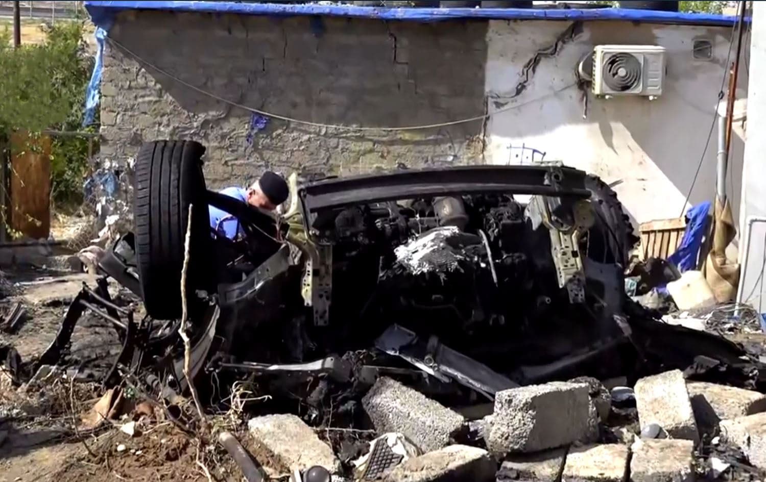 Authorities inspecting the site of a car explosion in Duhok province, August 28, 2025. Photo: Rudaw