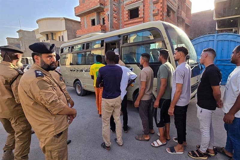 Members of Libya's Anti-Illegal Immigration Agency round up unregistered migrants from a housing unit in Tripoli. AFP file photo
