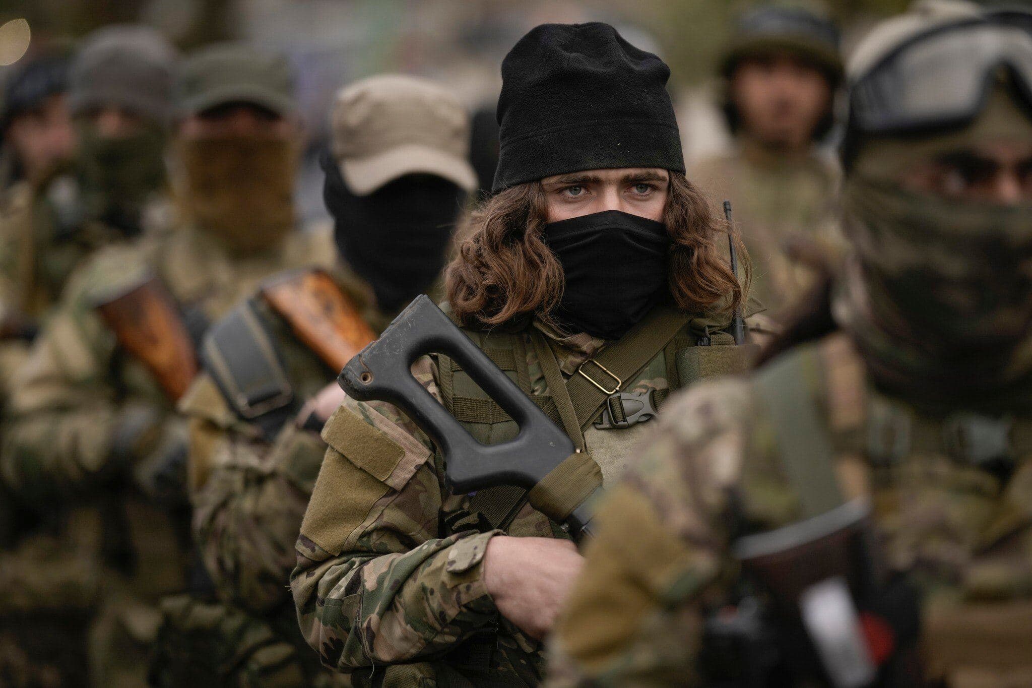 Members of the new Syrian armed forces stand in formation in downtown Damascus on December 27, 2024. Photo: AP