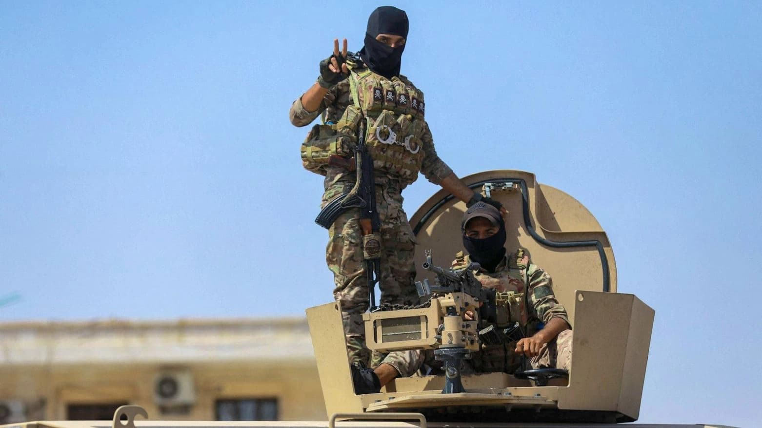 Two Syrian Democratic Forces (SDF) fighters while heading to a frontline in Syria’s eastern Deir ez-Zor province in September 2023. AFP file photo