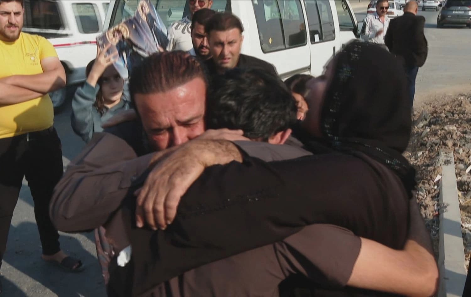 Parents of a Kurdish youth receiving their son in Erbil on November 7, 2025. Photo: screengrab/Rudaw