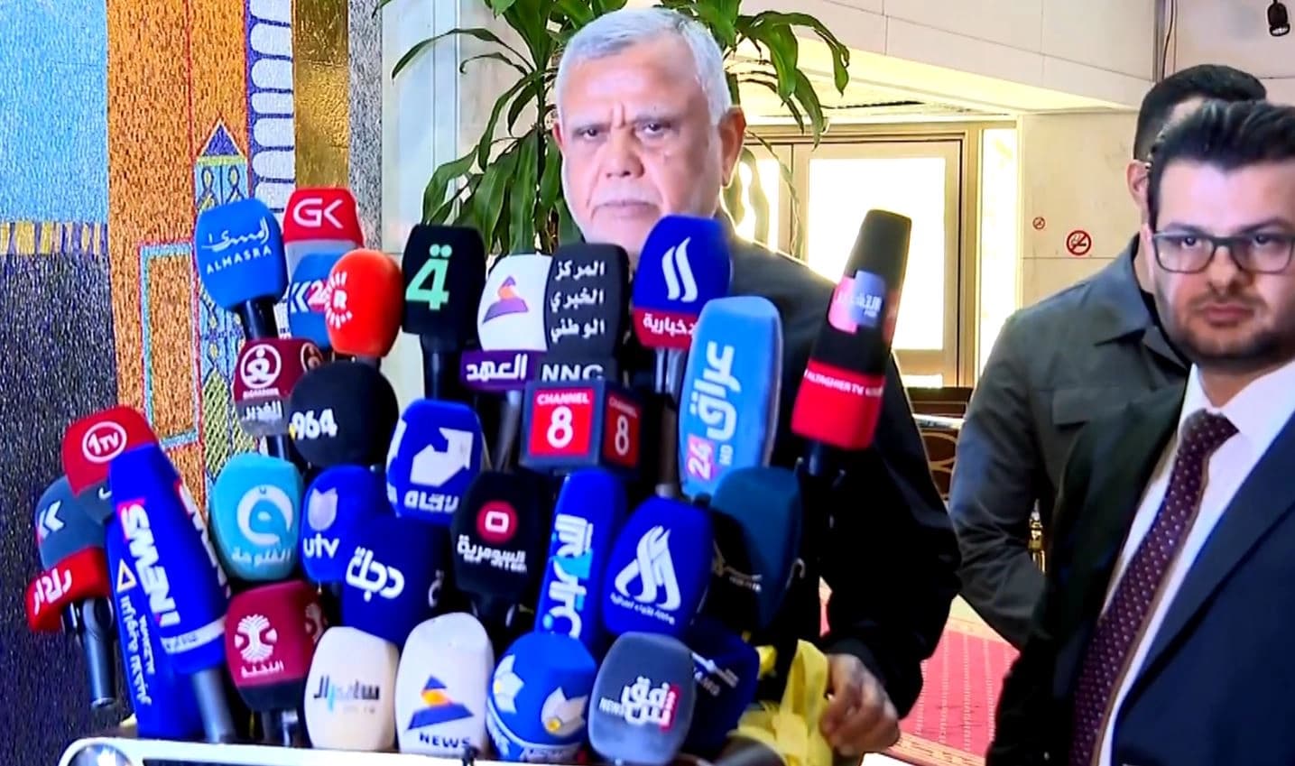 Hadi al-Ameri, head of Badr Organization, addresses reporters alongside Mohammad Raad, director of his media office, in Baghdad on November 11, 2025. Photo: Screengrab/Rudaw