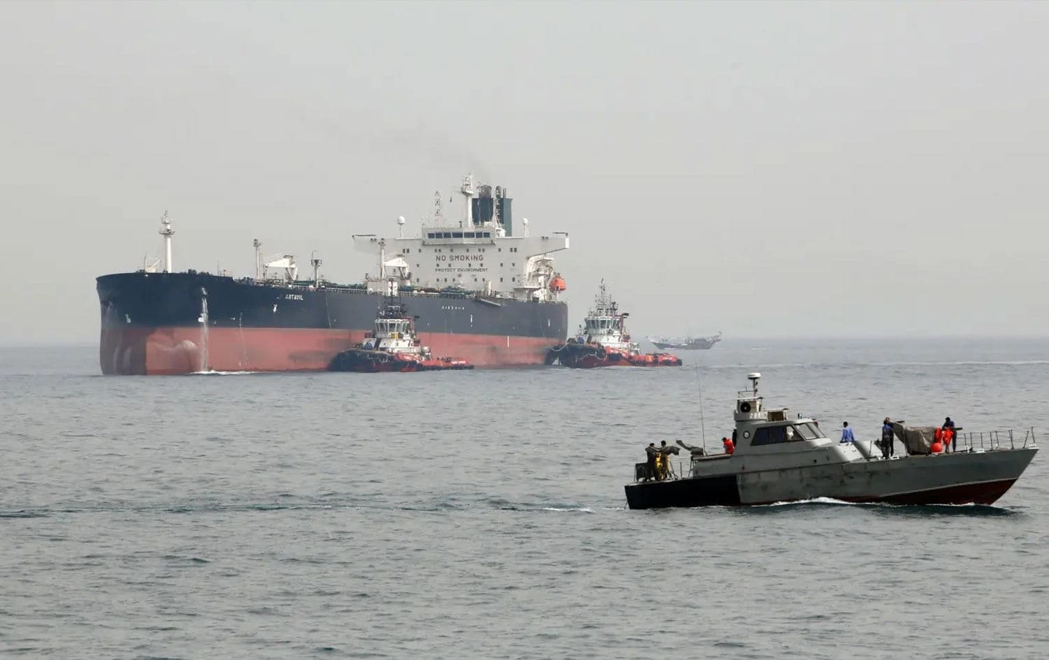 Iranian military speedboat patrolling the waters as a tanker prepares to dock at the oil facility on Kharg Island, Iran. File photo: AFP