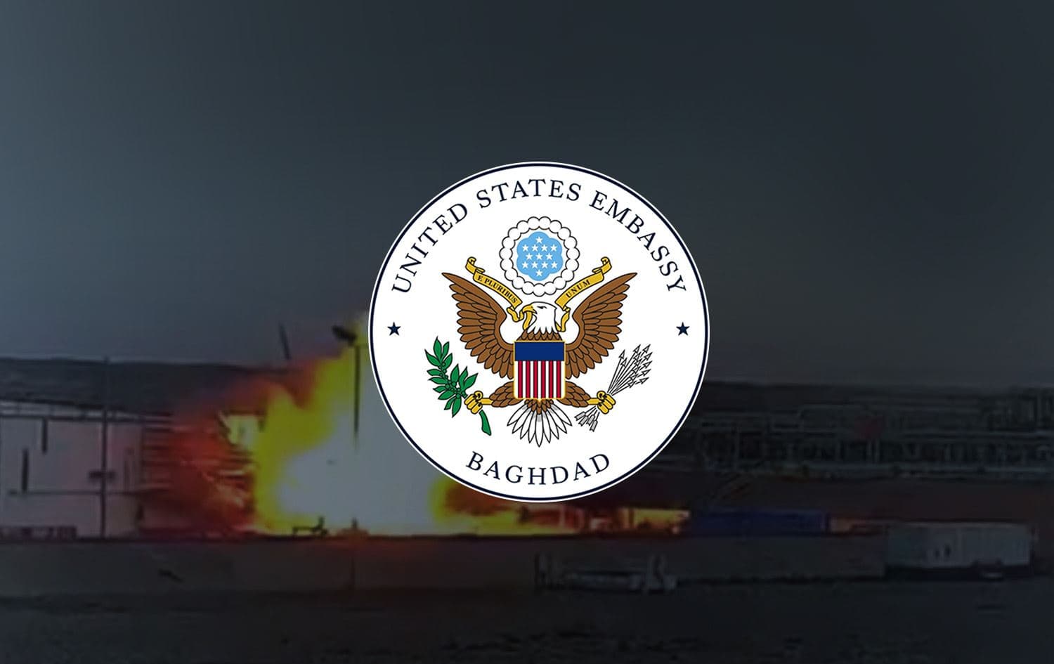 Emblem of the US embassy in Baghdad, with footage of the latest Khor Mor drone attack in the background. Graphic: Rudaw 