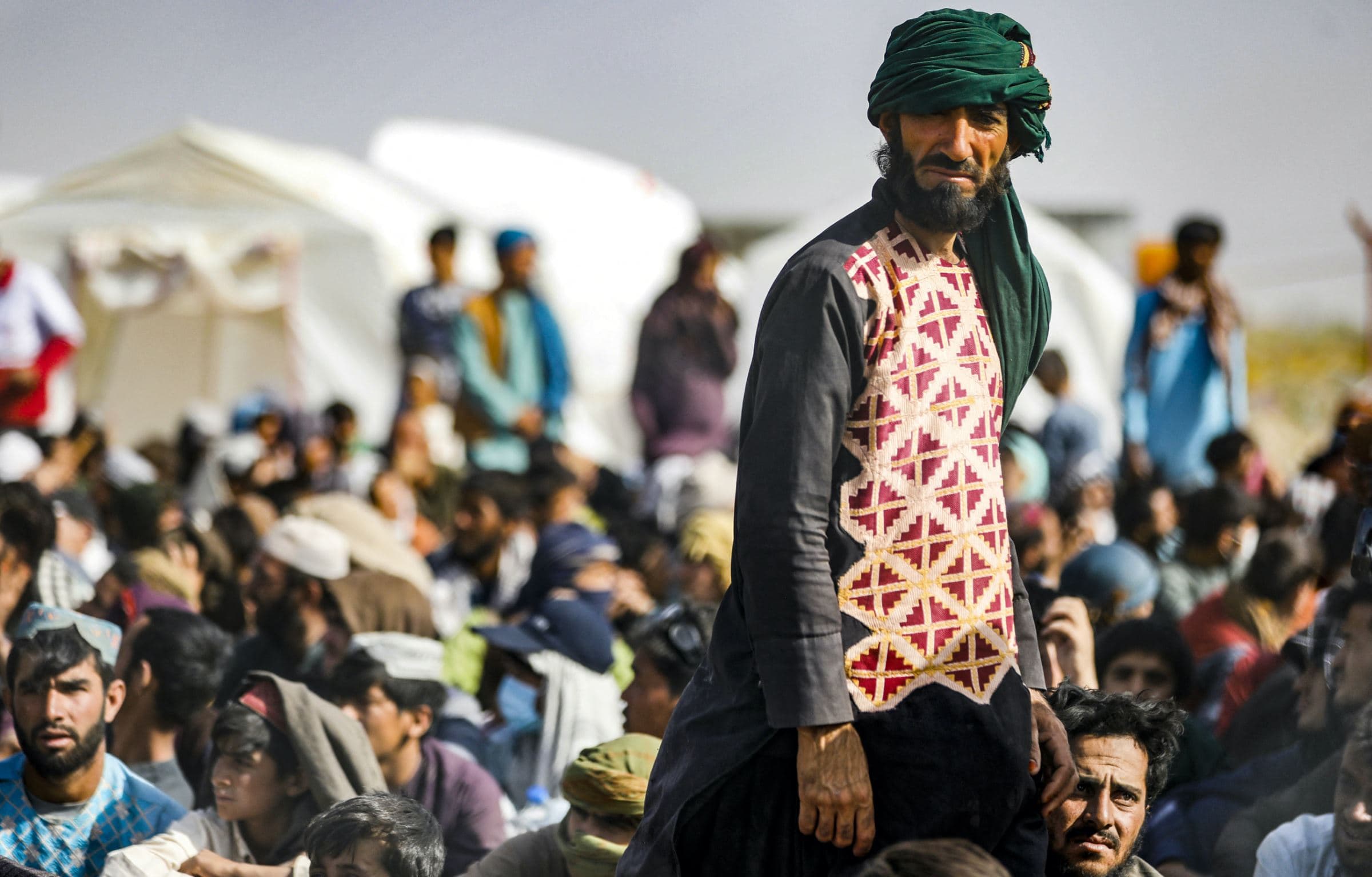 Afghan refugees gather at the Iran-Afghanistan border between Afghanistan and the southeastern Iranian Sistan and Baluchestan province in August 2021. File photo: AFP