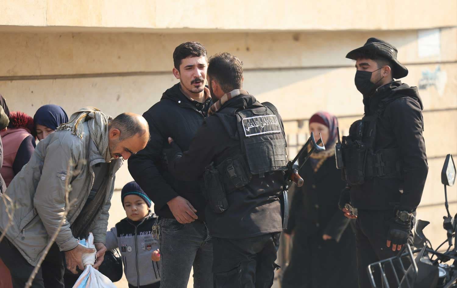 Syrian security forces inspect a resident in the Sheikh Maqsood and Ashrafiyeh neighborhoods of northern Aleppo province on December 24, 2025. Photo: Syrian Ministry of Interior/X