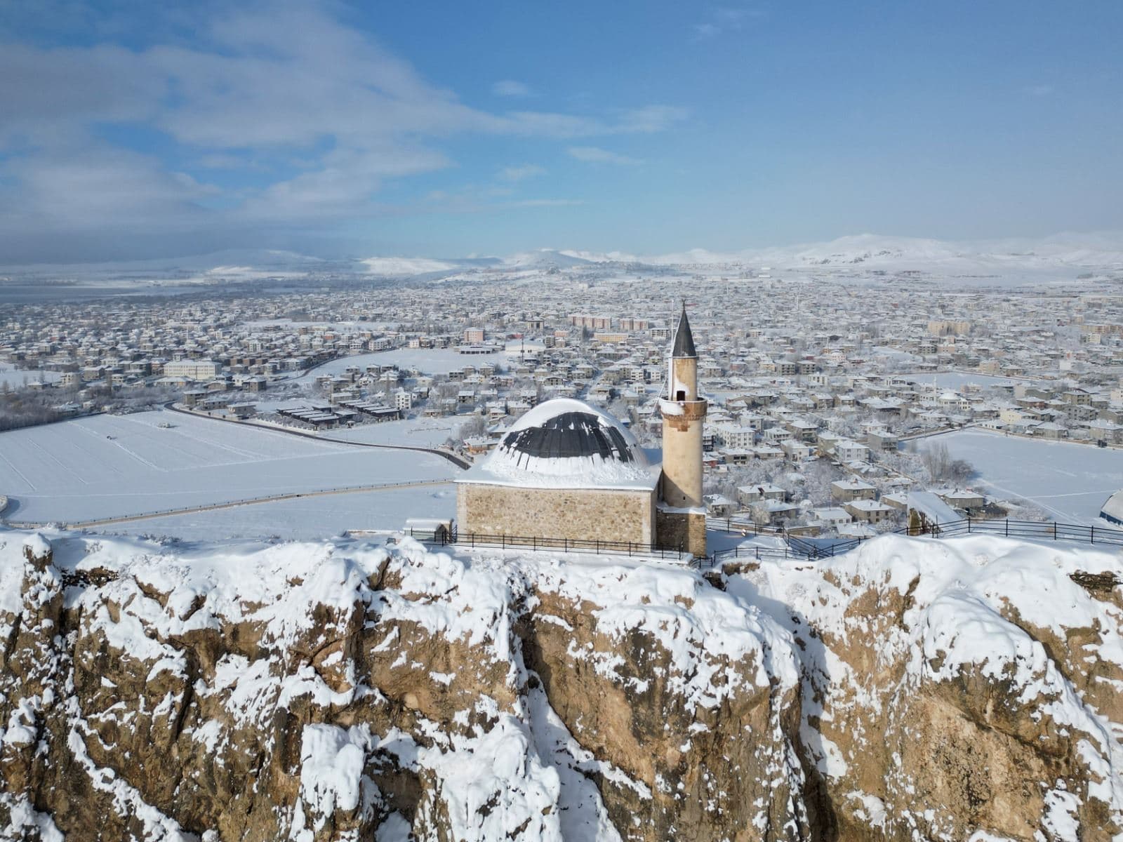 An aerial view shows historic structures covered in white following heavy snowfall during winter season in Van, Turkey, on December 28, 2025. Photo: AA