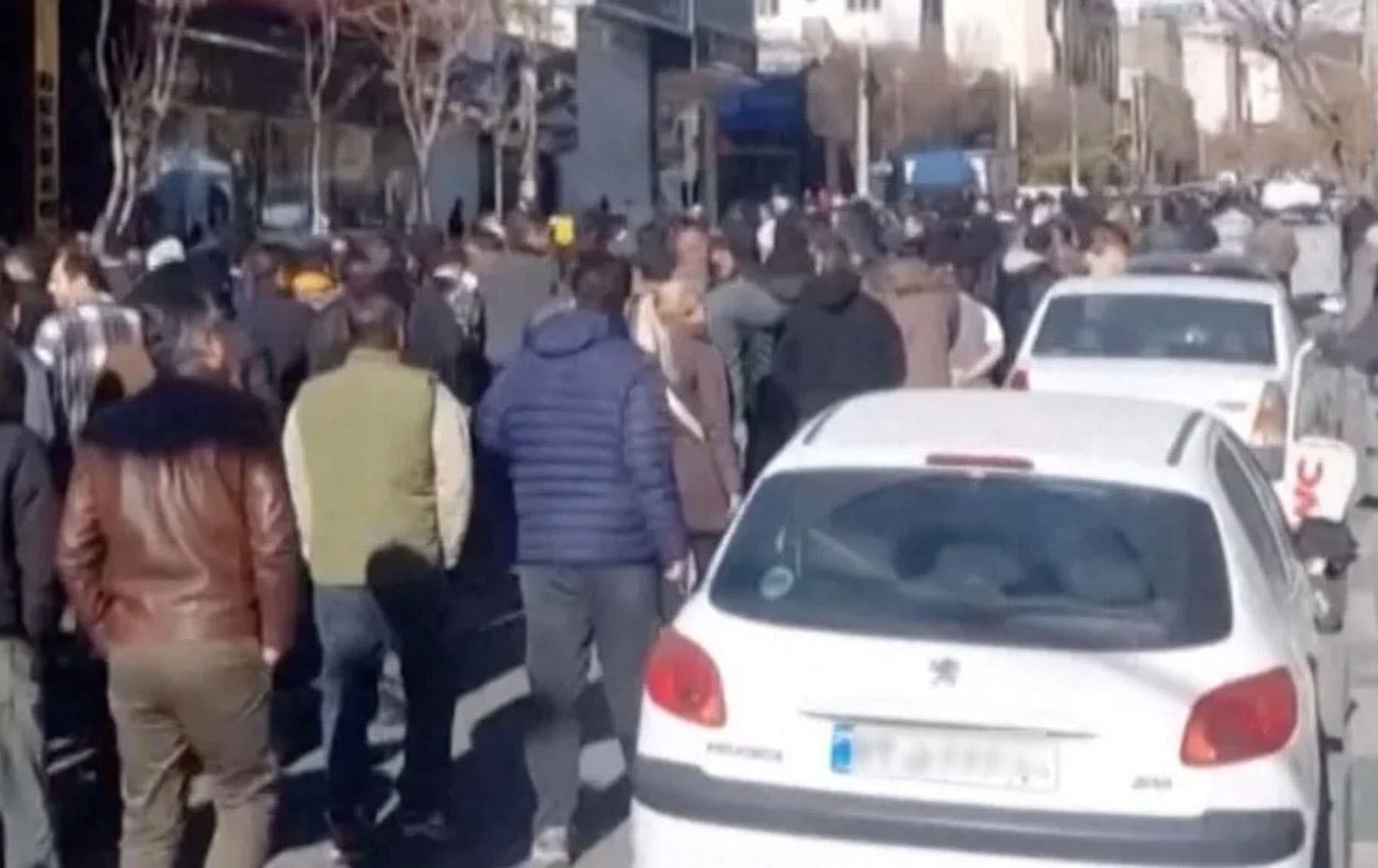 دیمەنێکی خۆپێشاندانەکان لە ئێران