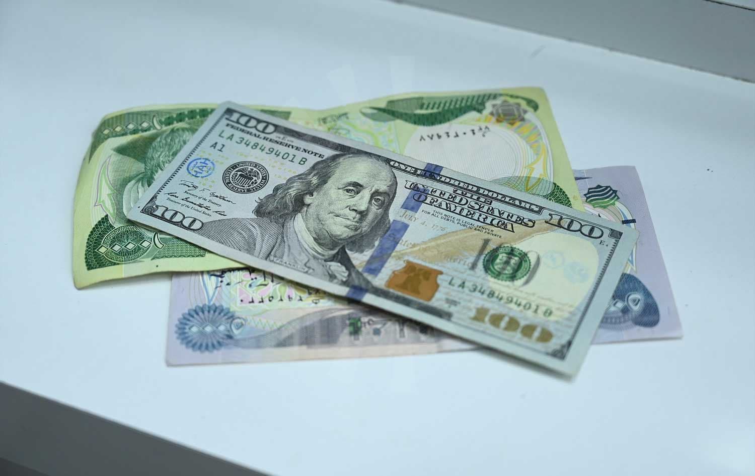 US dollar and Iraqi dinar banknotes. Photo: Bilind T. Abdullah/Rudaw