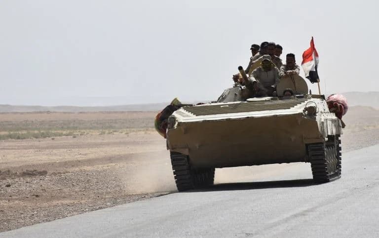 Iraqi army reinforcements drive down a road, linking Hawija to Kirkuk, near the village of Khabbaz on October 7, 2017. Photo: AFP