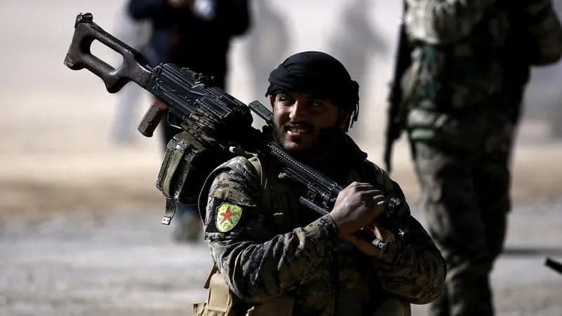 Fighters from the Syrian Democratic Forces (SDF) gather near a village north-east of Raqqa in February 2017. AFP file photo