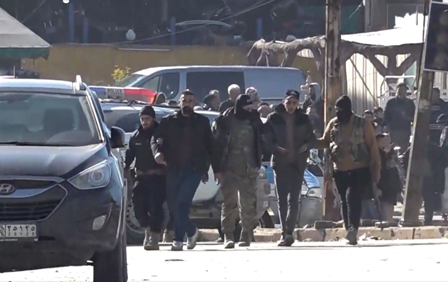 A video showing Damascus-allied armed members detaining two men in the Sheikh Maqsood neighborhood, Aleppo, Syria, on January 10, 2026. Photo: screengrab/Rudaw